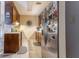 Galley kitchen with wood cabinets and stainless steel refrigerator maximizing space and style at 4407 S Shirley Dr, North Charleston, SC 29418