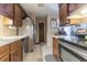 Functional kitchen with stainless steel appliances and wood cabinets offering modern conveniences at 4407 S Shirley Dr, North Charleston, SC 29418