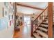 Inviting living room featuring wood floors, staircase, and decorative fireplace at 4407 S Shirley Dr, North Charleston, SC 29418