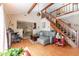 Cozy living room with hardwood floors and a modern staircase design at 4407 S Shirley Dr, North Charleston, SC 29418