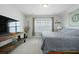 Cozy bedroom featuring a large window, a wooden media console, and neutral decor at 490 Rowley Ln, Summerville, SC 29486