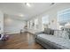 Bright bonus room with hardwood floors, multiple windows and a gray daybed at 490 Rowley Ln, Summerville, SC 29486