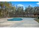 Inviting community pool with pristine landscaping, surrounded by tall trees for a private and relaxing experience at 490 Rowley Ln, Summerville, SC 29486