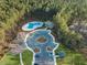 Aerial view of a community pool surrounded by lush trees, providing a relaxing and private swimming experience at 490 Rowley Ln, Summerville, SC 29486