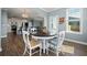 Dining area with table and chairs adjoining kitchen with stainless steel appliances and open archway to living room at 490 Rowley Ln, Summerville, SC 29486