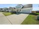 Attractive home with well-kept lawn, driveway leading to an attached two car garage at 490 Rowley Ln, Summerville, SC 29486