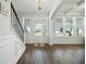 Elegant foyer with hardwood floors, natural light, and staircase with iron railings at 490 Rowley Ln, Summerville, SC 29486