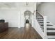 Hallway featuring luxury vinyl plank flooring, with an archway, and stairs to the second floor at 490 Rowley Ln, Summerville, SC 29486