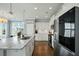 Bright kitchen with stainless steel appliances, granite countertops, and modern lighting at 490 Rowley Ln, Summerville, SC 29486