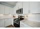 Modern kitchen with stainless steel appliances, granite countertops, and plenty of storage at 490 Rowley Ln, Summerville, SC 29486