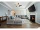 Spacious living room with a cozy seating area, fireplace, and stylish decor at 490 Rowley Ln, Summerville, SC 29486