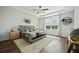 Well-lit main bedroom with a large window, tray ceiling, and a cozy rug under the bed at 490 Rowley Ln, Summerville, SC 29486