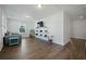 Bright playroom with hardwood floors, a daybed, and a TV with a creative shelving at 490 Rowley Ln, Summerville, SC 29486