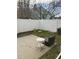 Cozy backyard with white fence, small patio, and room for outdoor seating and relaxation at 505 Sunnyside Way, Summerville, SC 29485