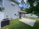 Exterior view of home highlighting the backyard featuring a concrete patio and privacy fence at 505 Sunnyside Way, Summerville, SC 29485