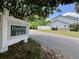Community sign that reads, Paradise Lakes, surrounded by lush green lawn at 505 Sunnyside Way, Summerville, SC 29485
