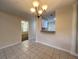 Dining room with tile flooring and decorative lighting fixture, conveniently located next to the kitchen at 505 Sunnyside Way, Summerville, SC 29485