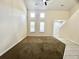 Spacious living room with high ceilings, lots of natural light, and neutral color palette at 505 Sunnyside Way, Summerville, SC 29485