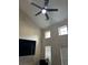 Bright living room with large ceiling fan and a tall ceiling at 505 Sunnyside Way, Summerville, SC 29485