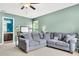 Inviting bedroom features a cozy sofa and a calm color palette, ideal for unwinding and peaceful sleep at 5228 Fallow Fawns Rd, Hollywood, SC 29449