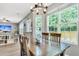 Cozy dining room featuring natural lighting, hardwood floors, and a rustic wooden table at 5228 Fallow Fawns Rd, Hollywood, SC 29449