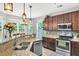 Modern kitchen featuring stainless steel appliances, granite countertops, and a breakfast bar at 5228 Fallow Fawns Rd, Hollywood, SC 29449
