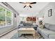Open-concept living room flowing into kitchen with hardwood floors and stylish furniture at 5228 Fallow Fawns Rd, Hollywood, SC 29449