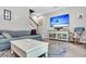 Cozy living room with a plush sofa, stylish coffee table, and large TV at 5228 Fallow Fawns Rd, Hollywood, SC 29449