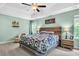 Serene main bedroom with a tray ceiling, comfy king bed, and soft lighting, creating a tranquil retreat at 5228 Fallow Fawns Rd, Hollywood, SC 29449