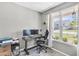 Well-lit home office featuring a desk, comfortable chair, and a large window with a view at 5228 Fallow Fawns Rd, Hollywood, SC 29449