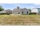 Backyard with green grass, a patio, and a house with gray siding, perfect for outdoor living at 5376 Copley Cir, Summerville, SC 29485