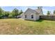 The backyard features a large grassy area, patio, and wood fence at 5376 Copley Cir, Summerville, SC 29485