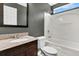 Bathroom with a granite countertop vanity, a shower-tub combo, and modern fixtures, adding style at 5376 Copley Cir, Summerville, SC 29485