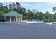 Community pool area with a shaded pavilion and accessible parking at 5376 Copley Cir, Summerville, SC 29485