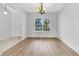 Bright dining room with hardwood floors, a chandelier, and a large window at 5376 Copley Cir, Summerville, SC 29485