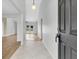 Inviting entryway with tile transitioning to wood floors and views of the bright, open living space at 5376 Copley Cir, Summerville, SC 29485