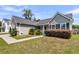 Well-maintained home with tidy lawn, landscaped shrubbery, and convenient walkway to the front door at 5376 Copley Cir, Summerville, SC 29485