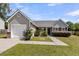 Attractive single-story home with a lush green lawn, integrated garage, and well-maintained front garden at 5376 Copley Cir, Summerville, SC 29485