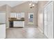 Bright eat-in kitchen featuring white cabinets, granite countertops, stainless steel dishwasher, and tile flooring at 5376 Copley Cir, Summerville, SC 29485