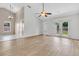 Spacious open-concept area with vaulted ceilings, light wood floors, and views of the backyard at 5376 Copley Cir, Summerville, SC 29485