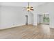 Bright, open living room featuring vaulted ceilings, wood floors, and views of adjacent spaces at 5376 Copley Cir, Summerville, SC 29485