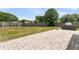 Patio with built-in barbeque pit extends to a large grassy backyard at 5376 Copley Cir, Summerville, SC 29485