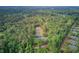 Aerial view of property showcasing a home surrounded by lush forest at 5669 Sands Rd, Hollywood, SC 29449