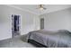 Primary bedroom featuring a neutral color scheme, a ceiling fan, and doorway to the en suite bathroom at 5669 Sands Rd, Hollywood, SC 29449