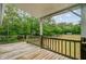 Expansive wooden deck overlooking a verdant backyard, perfect for outdoor entertaining and relaxation at 5669 Sands Rd, Hollywood, SC 29449
