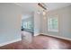 Cozy dining room with modern lighting, wood-look floors, and ample natural light at 5669 Sands Rd, Hollywood, SC 29449