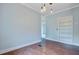 Inviting dining room with wood-look flooring, built-in shelving, and neutral paint at 5669 Sands Rd, Hollywood, SC 29449