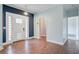 Entryway with hardwood floors, a white door with sidelights, and modern fixtures at 5669 Sands Rd, Hollywood, SC 29449