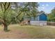 Shows the home's entrance and elevation of home on a garage and large yard at 5669 Sands Rd, Hollywood, SC 29449