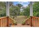 Charming porch offers views of the property's spacious yard and mature trees at 5669 Sands Rd, Hollywood, SC 29449